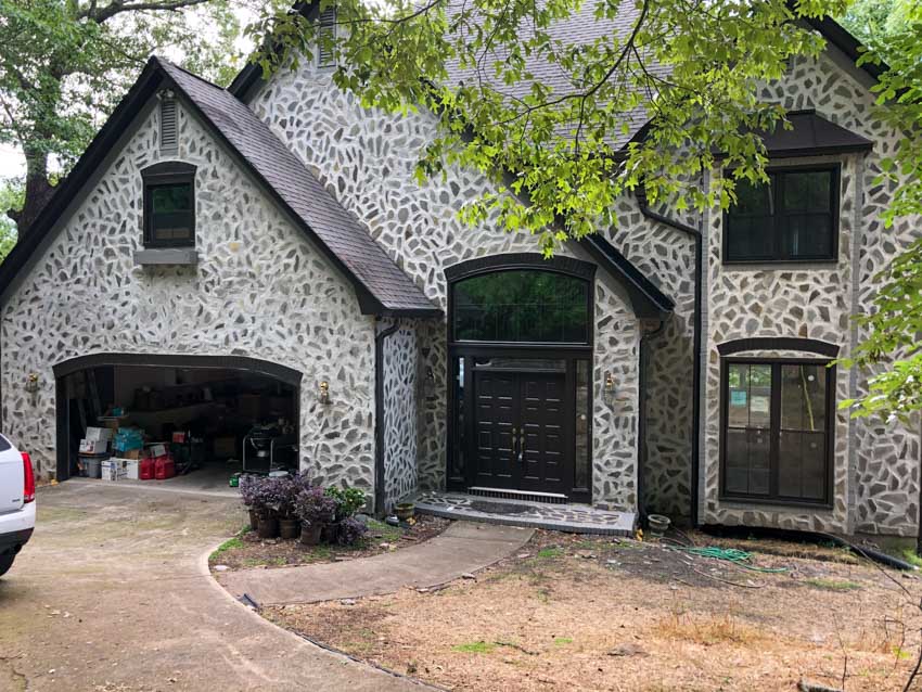 A technician checking the temperature regulator of a water heater